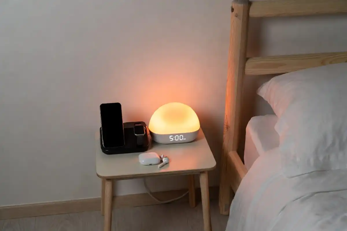 Bedroom nightstand with wireless charger and sunrise alarm clock