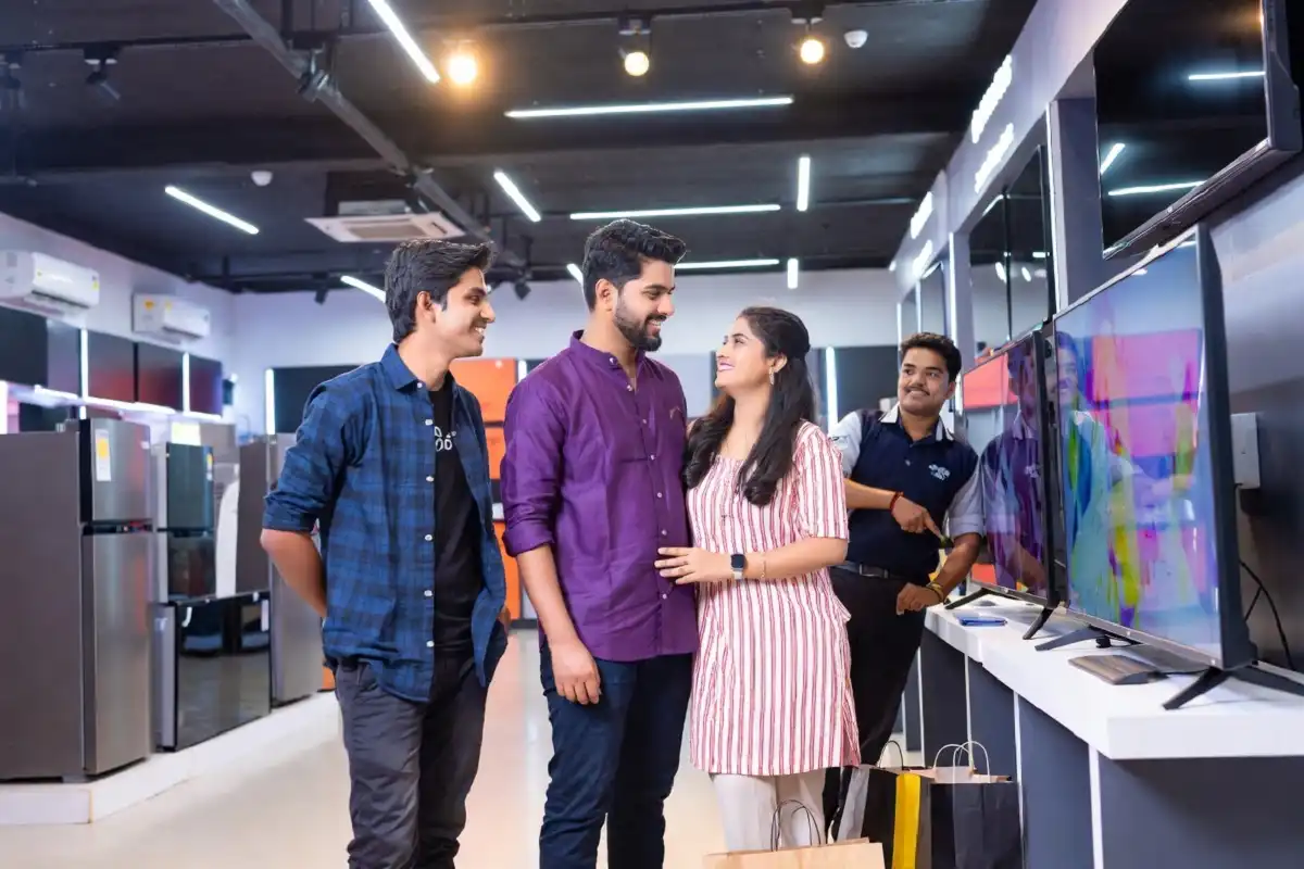 Indian shopper comparing Cellecor Gadgets Ltd products in an electronics store
