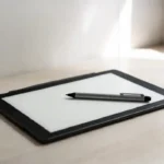 E ink writing tablet with stylus on a clean modern desk for note-taking