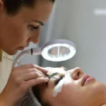 Professional lash tech near me applying eyelash extensions in a clean salon setting