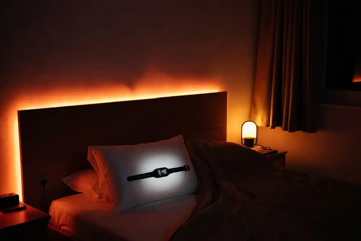 Smart alarm clock and sleep tracker on a bedside table
