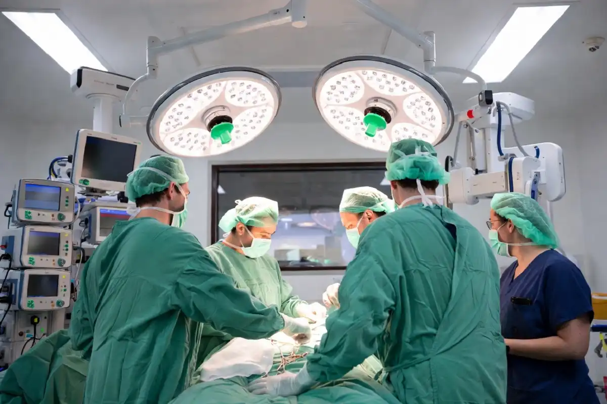 Surgical team performing a procedure in a modern hospital operating room