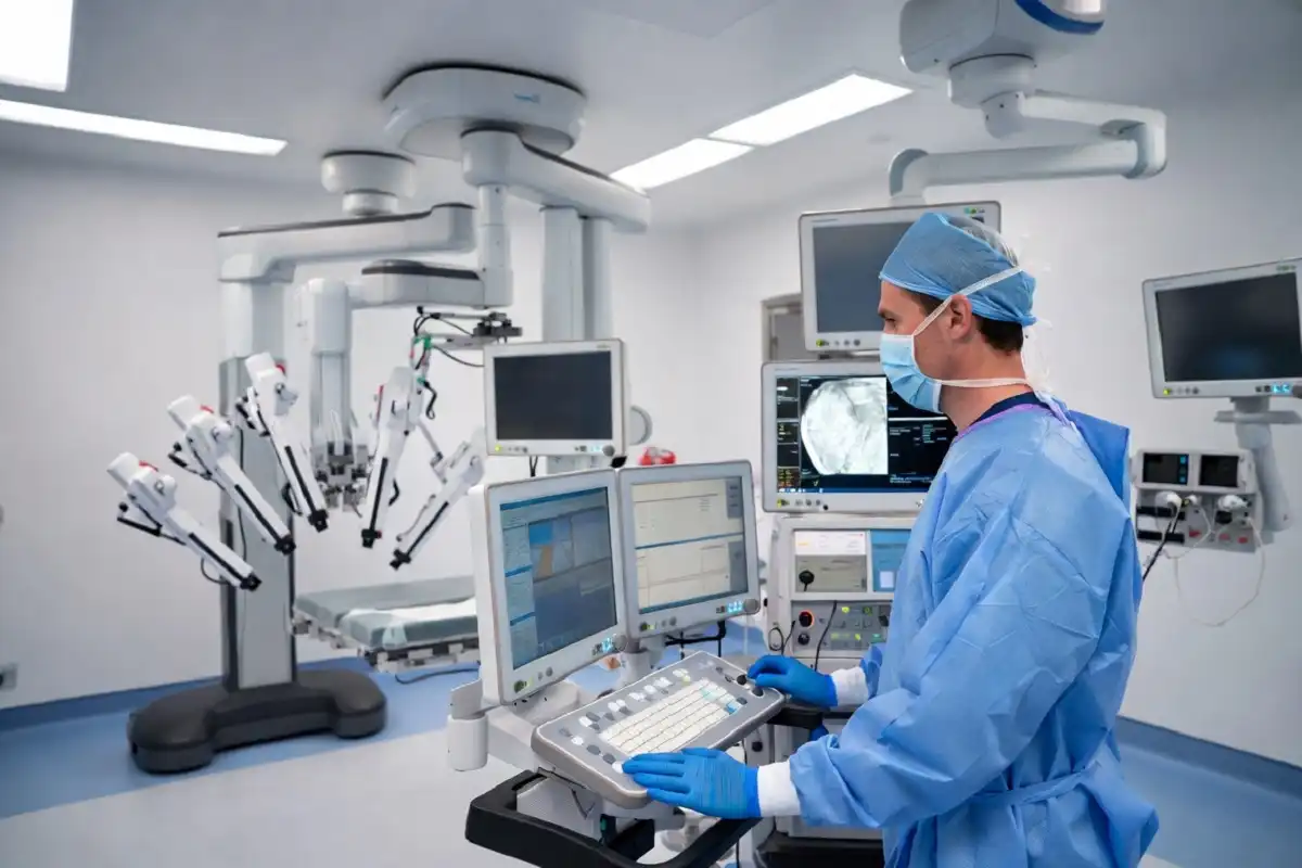 Surgical technologist working alongside robotic surgery equipment in a modern OR for surgical tech jobs