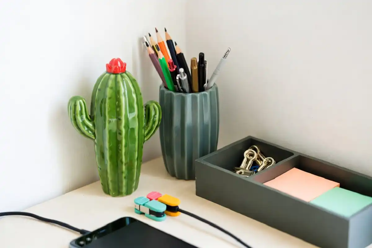 Neat desk with playful pen holder, mini trays, and cable organizers