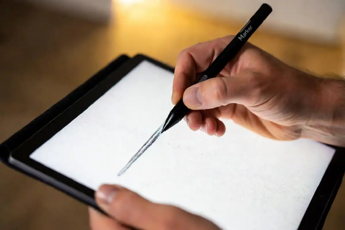 Writing on a refurbished reMarkable Paper Pro with a Marker stylus showing the paper-like feel