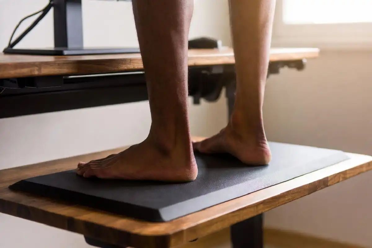 Anti-fatigue mat as one of the standing desk accessories essentials for reducing leg strain