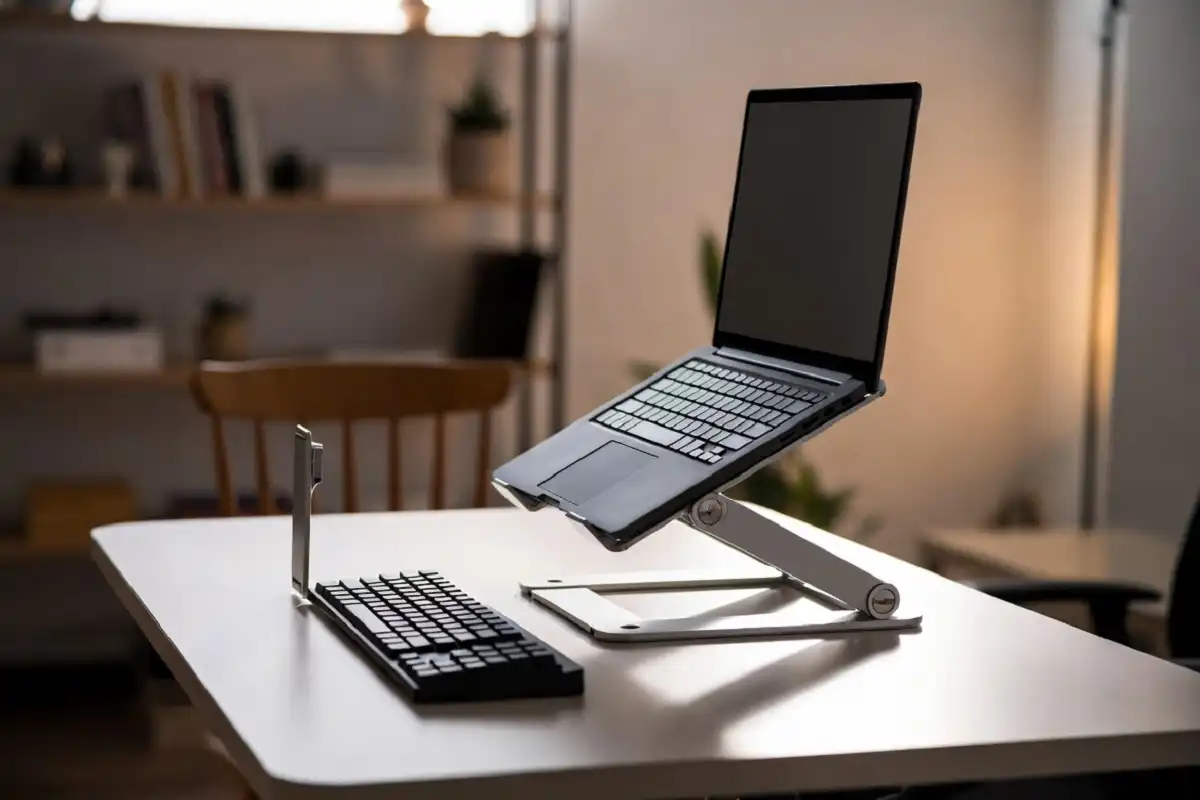 Laptop stand as part of standing desk accessories essentials for better neck and eye alignment